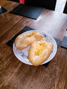 Crisp-filled baguette split into two pieces