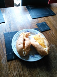 Baguette filled with crisps and split into halves