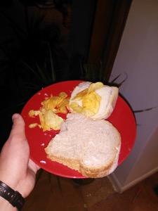 Crisps on, in and alongside white and brown bread