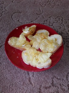 Several slices of bread topped with crisps and brie