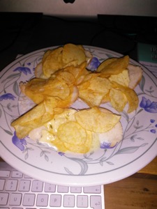 Flash photo of crisps and cheese on white bread