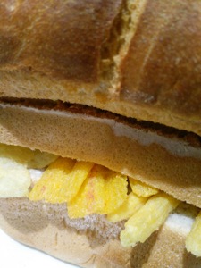 Close-up of loaf with crisps, Frazzles and Chipsticks