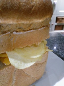 Close-up of side of loaf with crisps and Frazzles