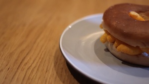 Panning across to a bagel filled with Wotsits