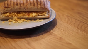 Turning to reveal a crushed crisp panini