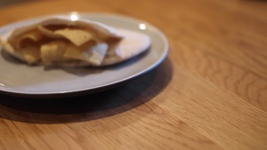 Turning to reveal a Quavers-filled pitta bread