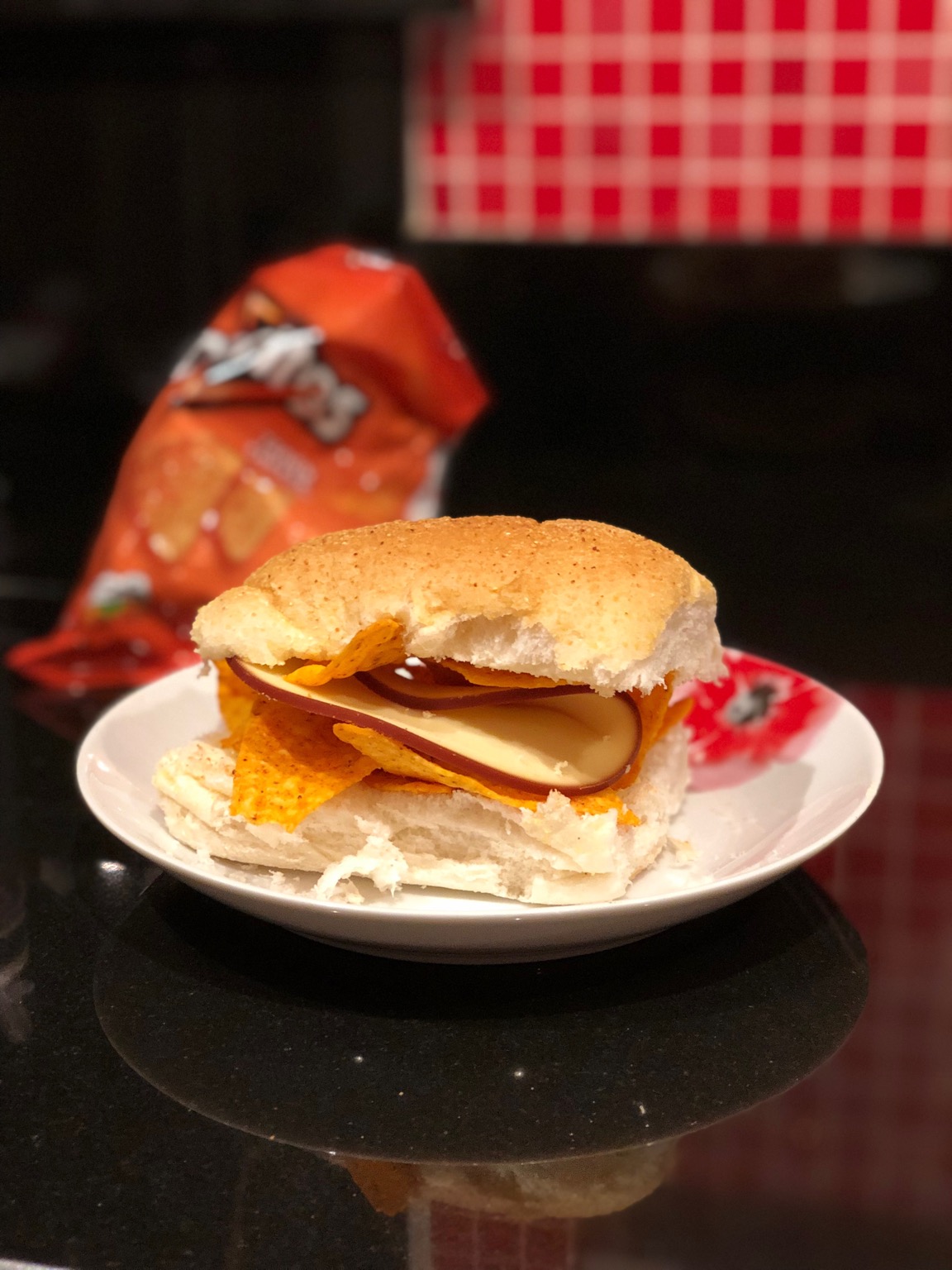 White roll containing Doritos and cheese