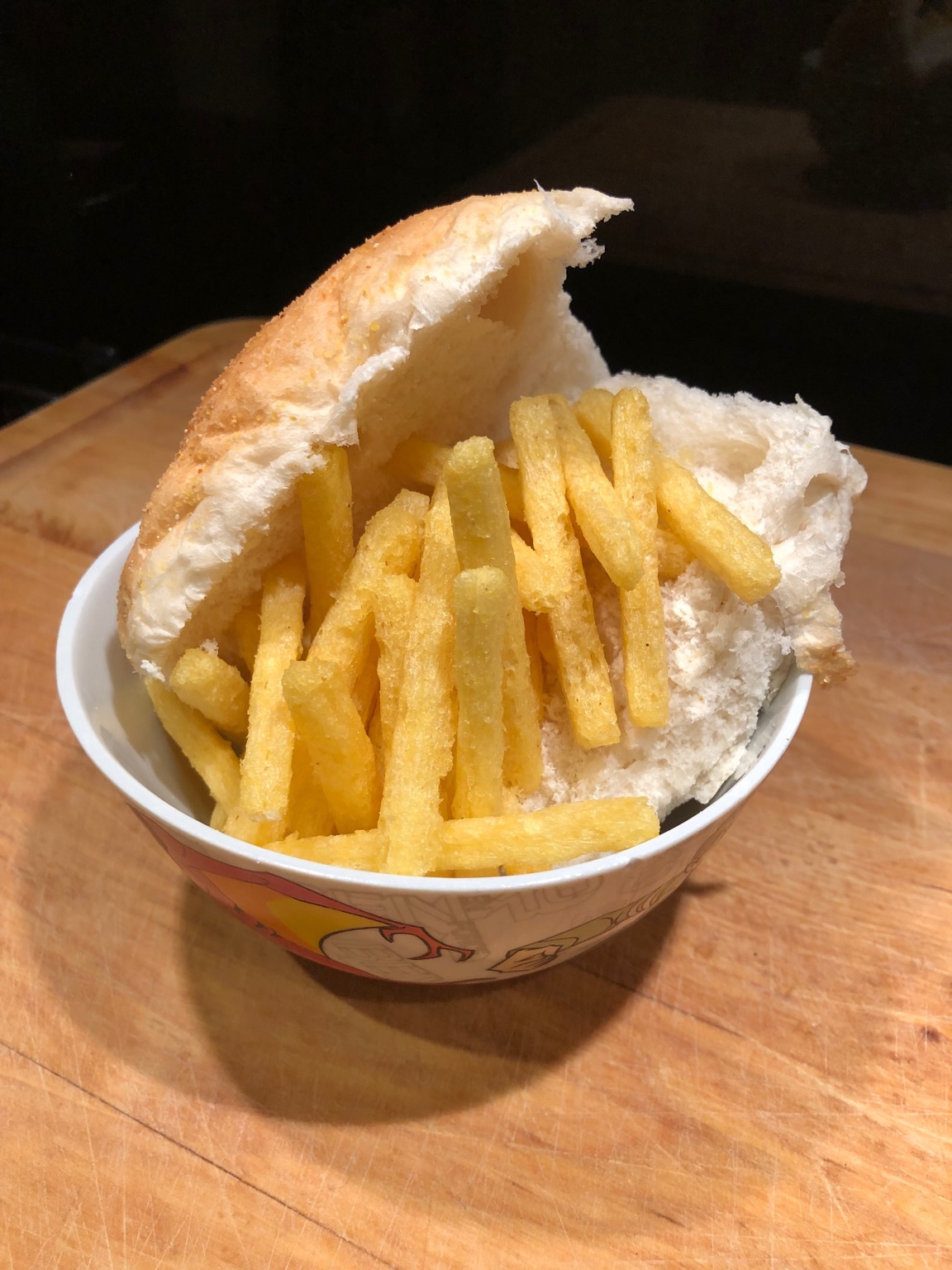 Half-open white roll with Chipsticks piled in