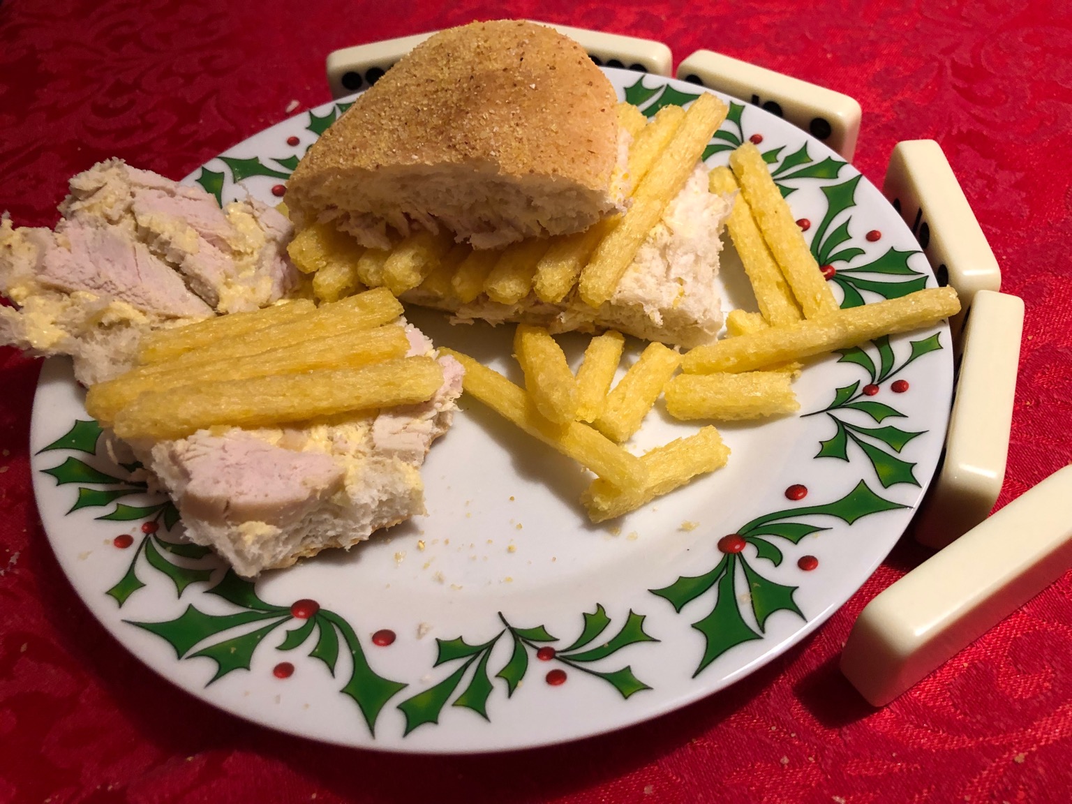 Chipsticks and meat in a roll, half open and bitten