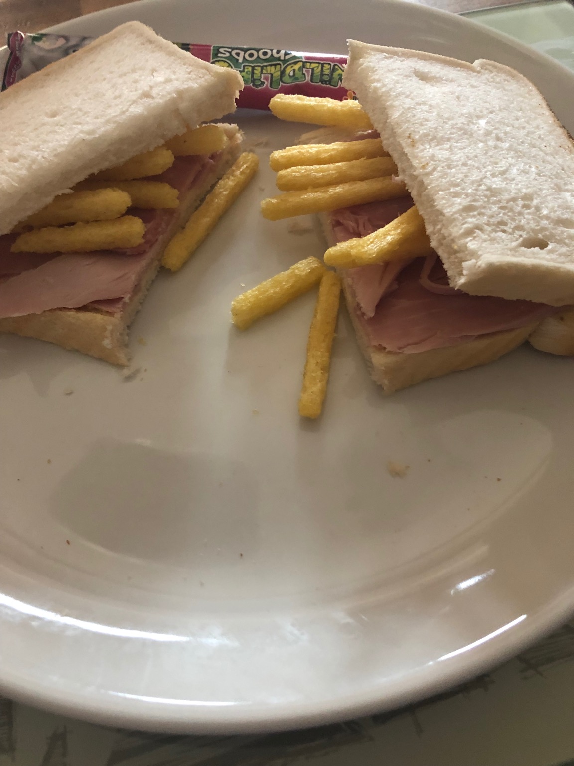 Chipsticks and ham in white sliced bread