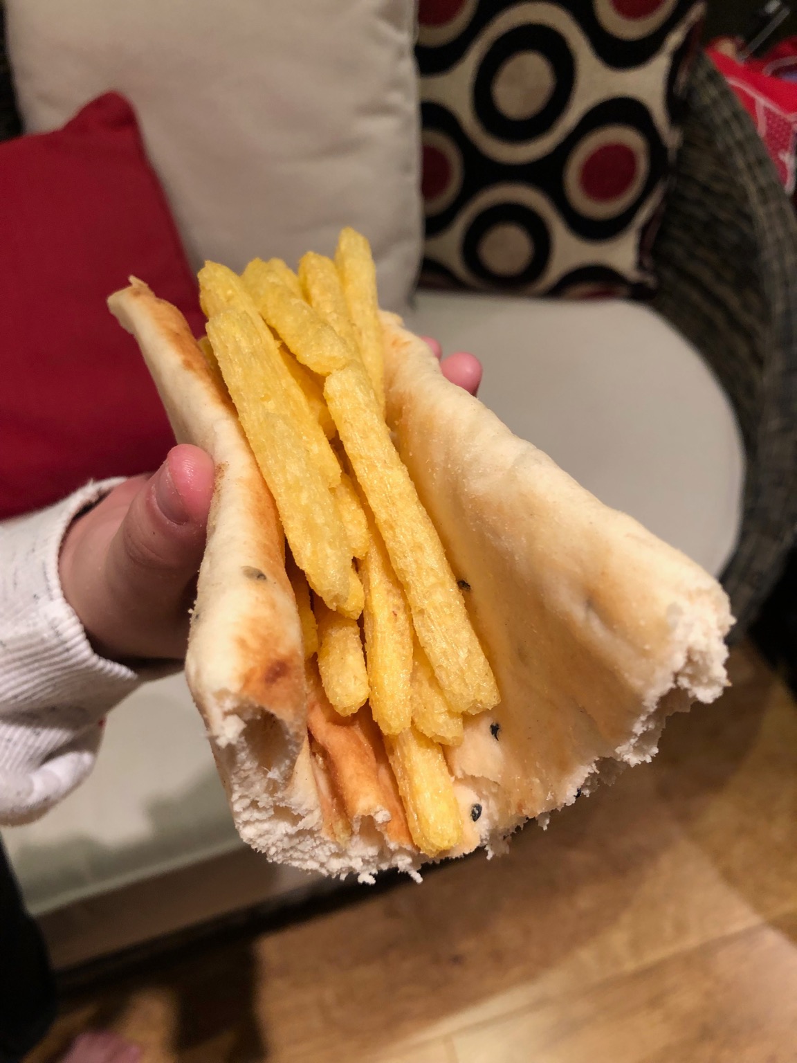 Chipsticks held in part of a naan bread