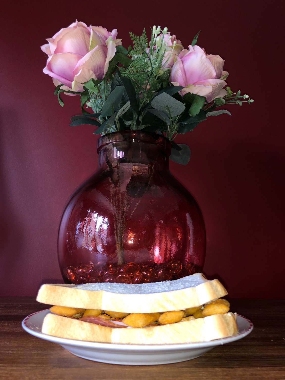 Scampi Fries and salami sandwich alongside vase