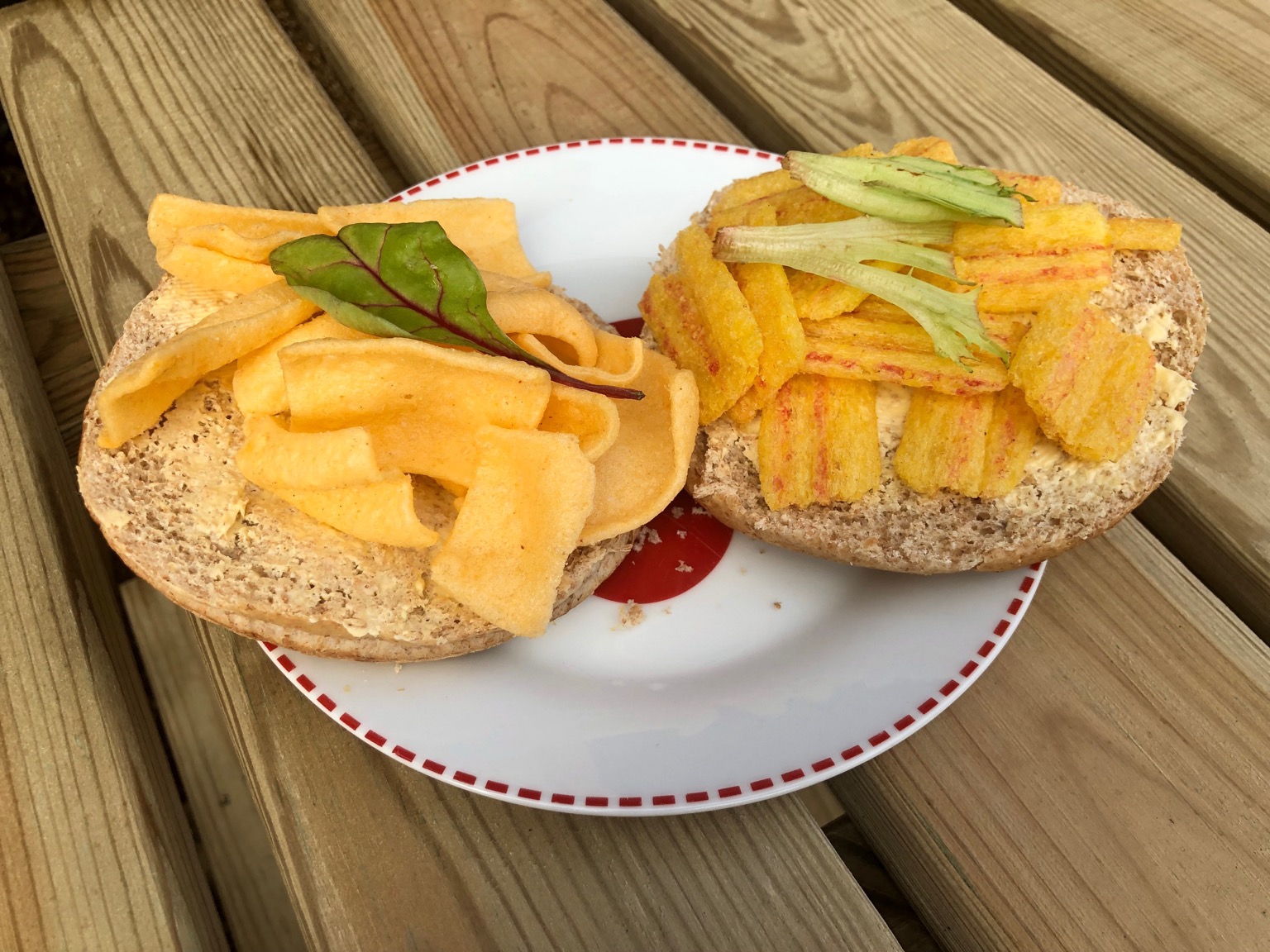 Corn snacks on an open brown roll with garnish
