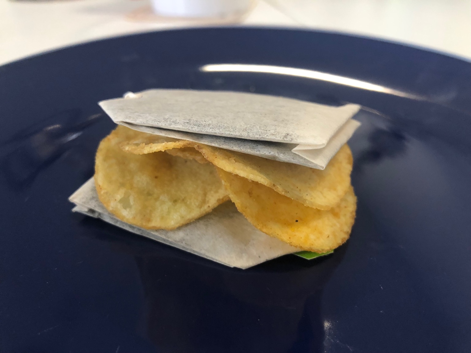 Crisps playfully sandwiched between teabags
