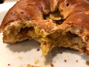 Close-up of crisp bagel with bites taken out of it