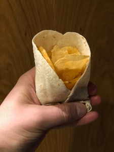 Potato crisps held in a tortilla wrap