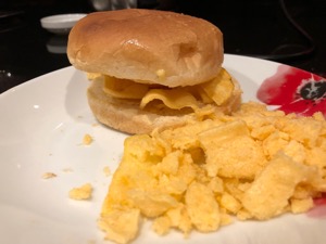 Corn snacks within and alongside a white roll