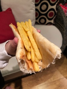 Chipsticks held in part of a naan bread