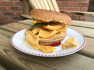 Corn snacks within and around a brown roll