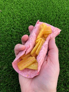 Frazzles held within a pink tortilla wrap