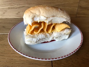 Buttered white roll containing corn snacks