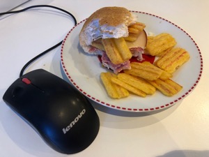 Frazzles, cheese and salami roll alongside mouse