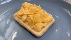 White bread covered with Quavers rotating in slow motion