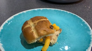 Hot cross bun filled with Wotsits rotating