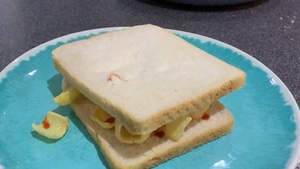 Sandwich of Quavers and sauce rotating in slow motion