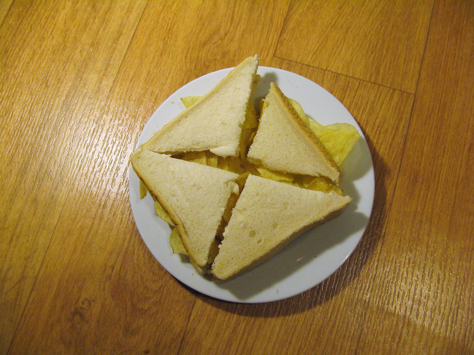 Overhead view of diagonally quartered crisp sandwich