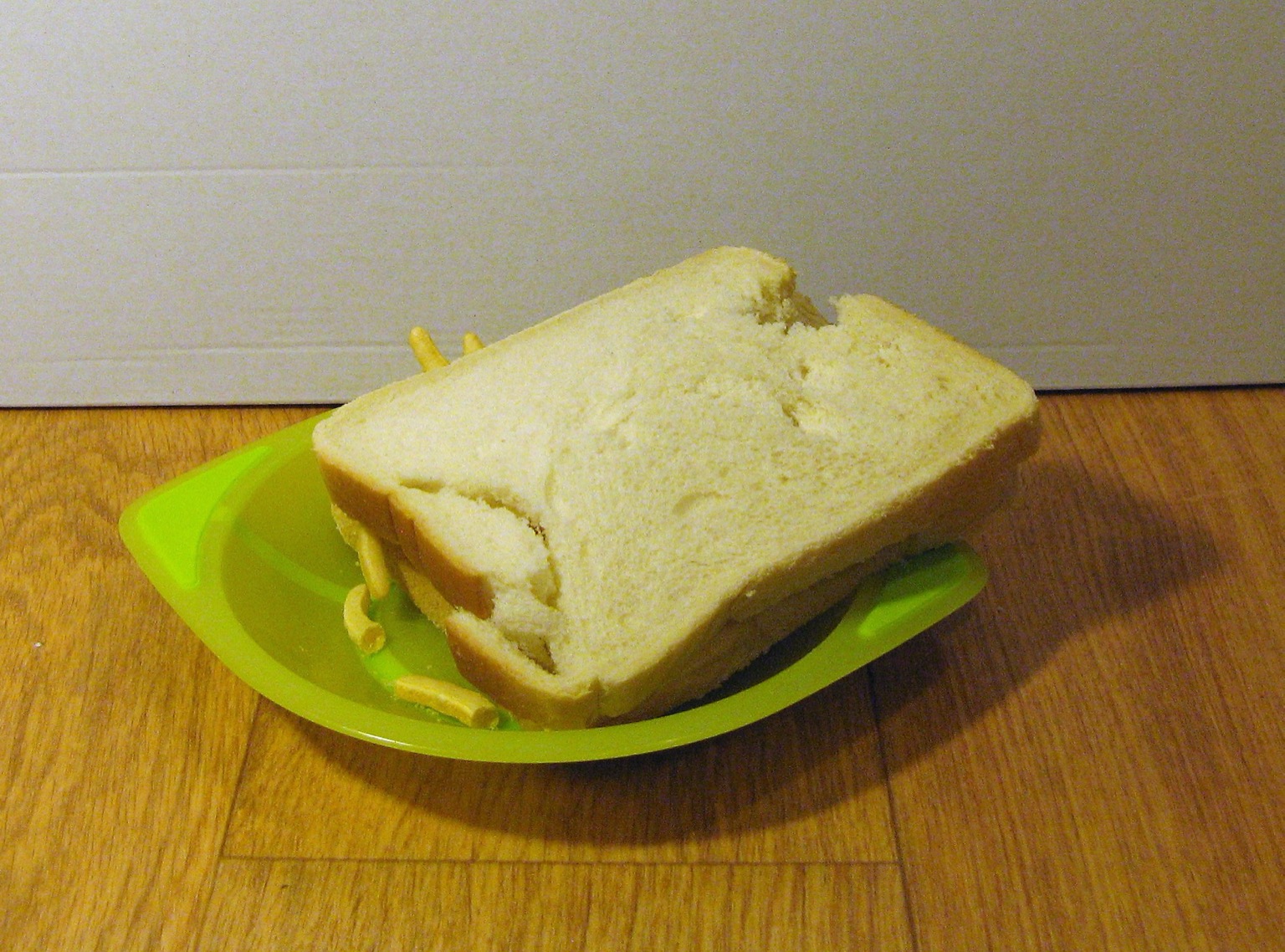 White French Fries sandwich in a plastic bowl