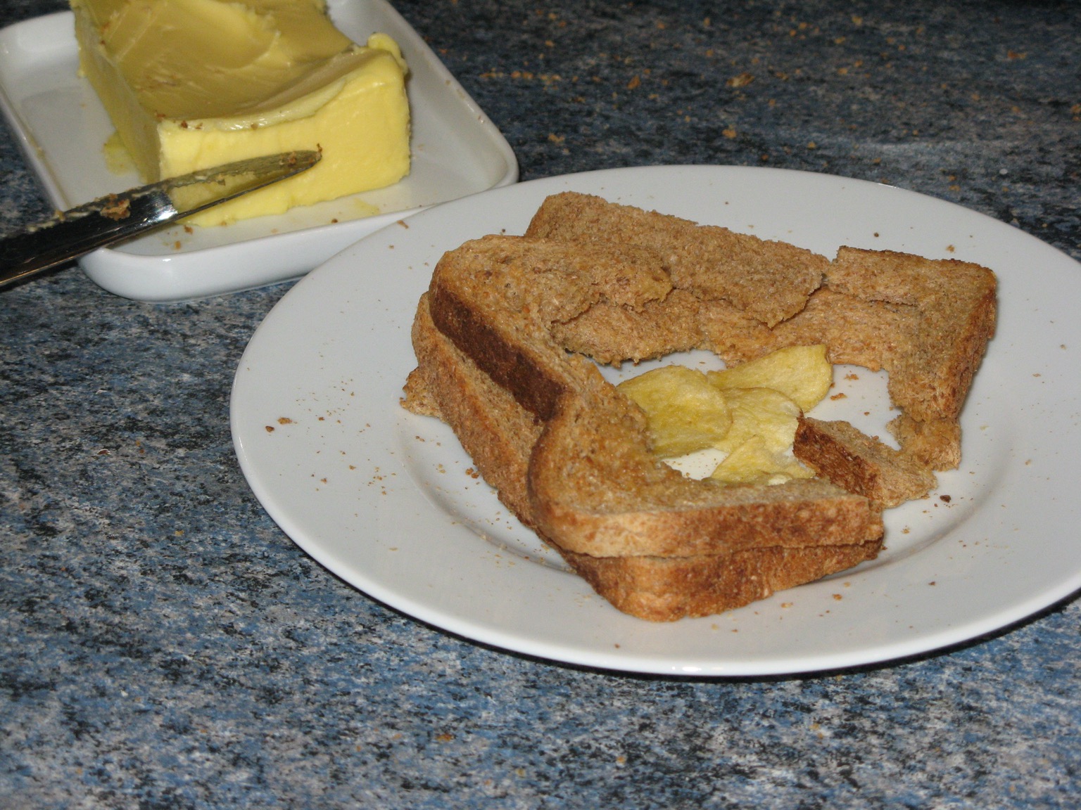 Remnants of a brown crisp sandwich