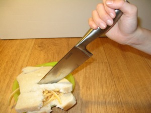 French Fries sandwich stabbed using a kitchen knife