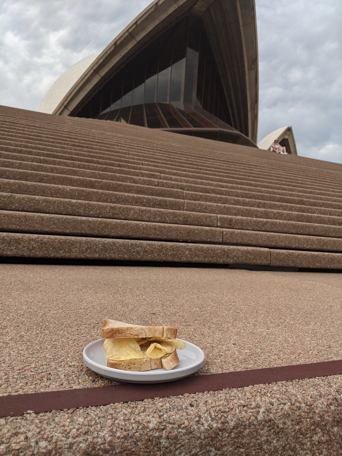 Crisp sandwich on steps alongside Sydney Opera House