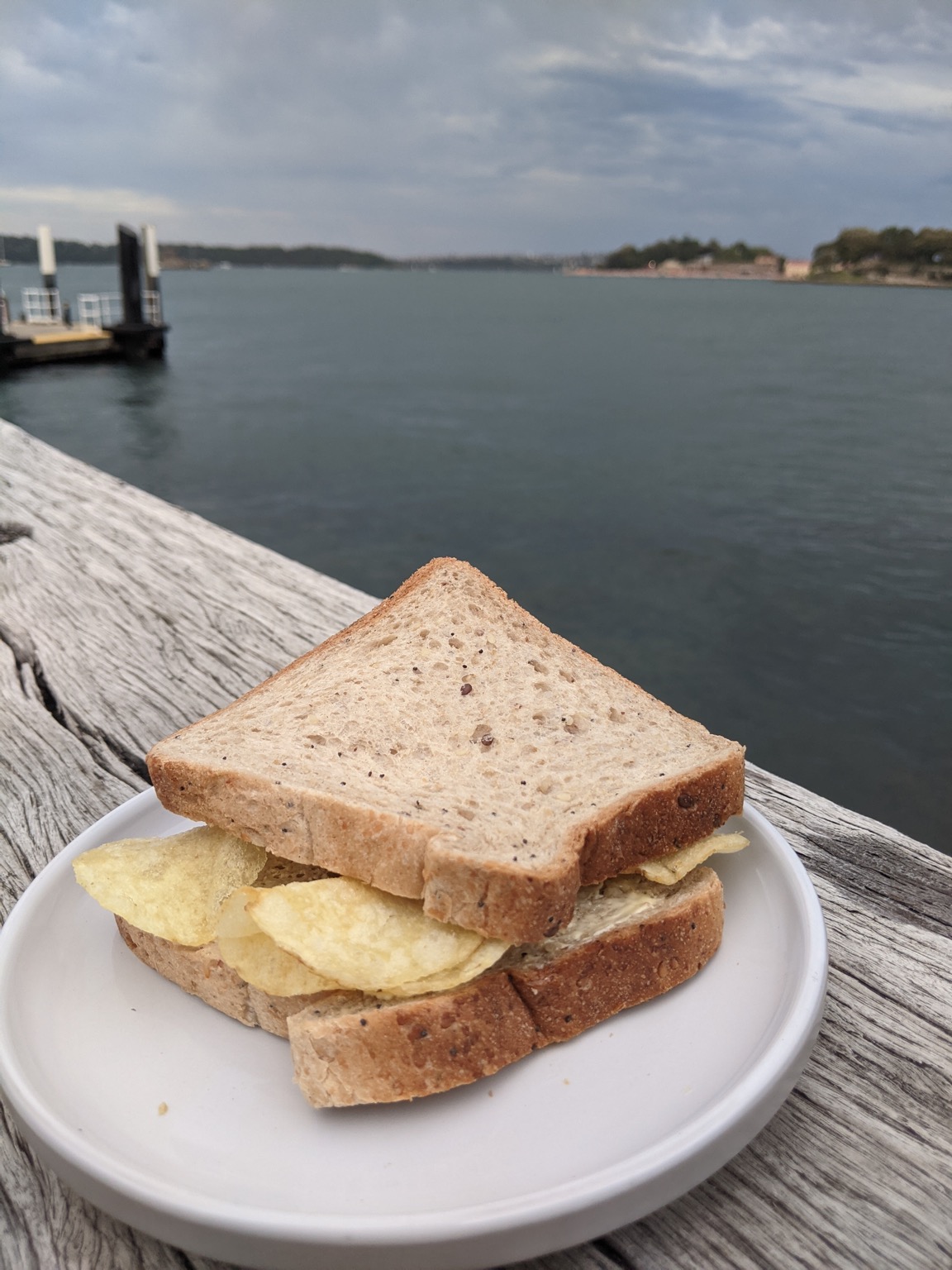 Crisp sandwich on a plate on a jetty