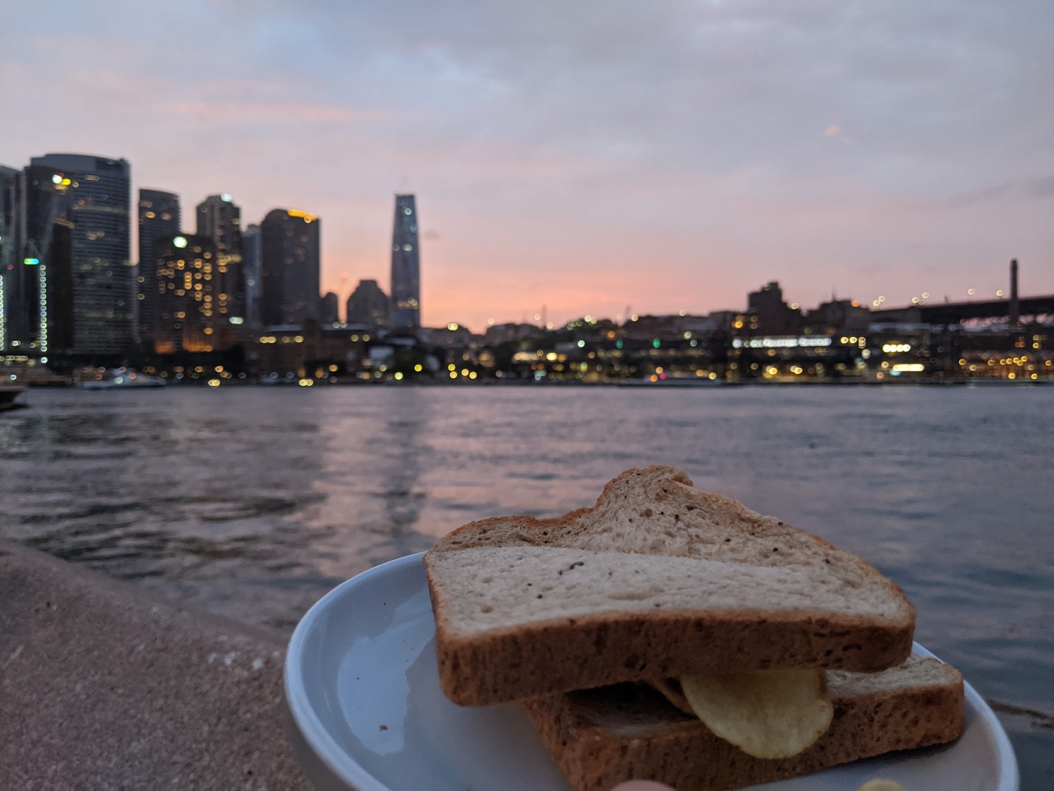 Sydney in the evening as backdrop to a crisp sandwich