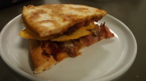 Crisps sandwiched between two slices of pizza