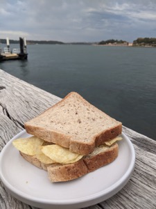 Crisp sandwich on a plate on a jetty