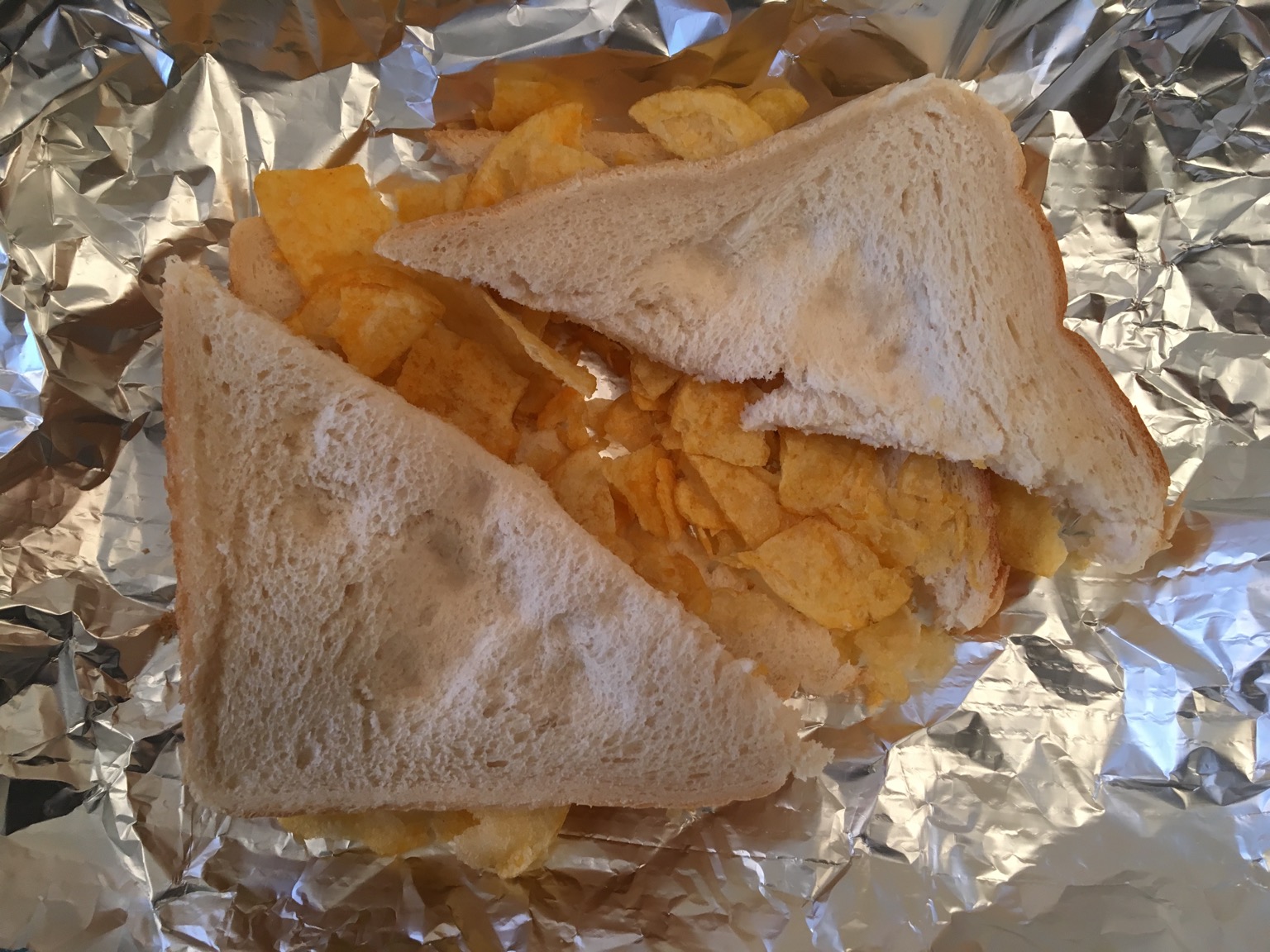 White crisp sandwich with a foil backdrop