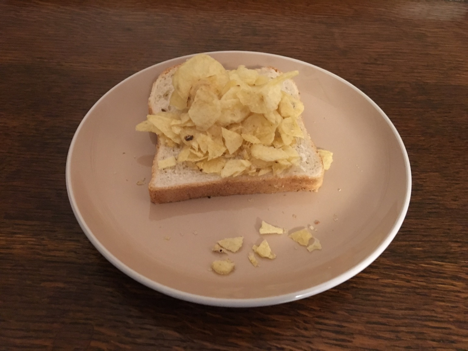 Potato crisps on a single slice of white bread
