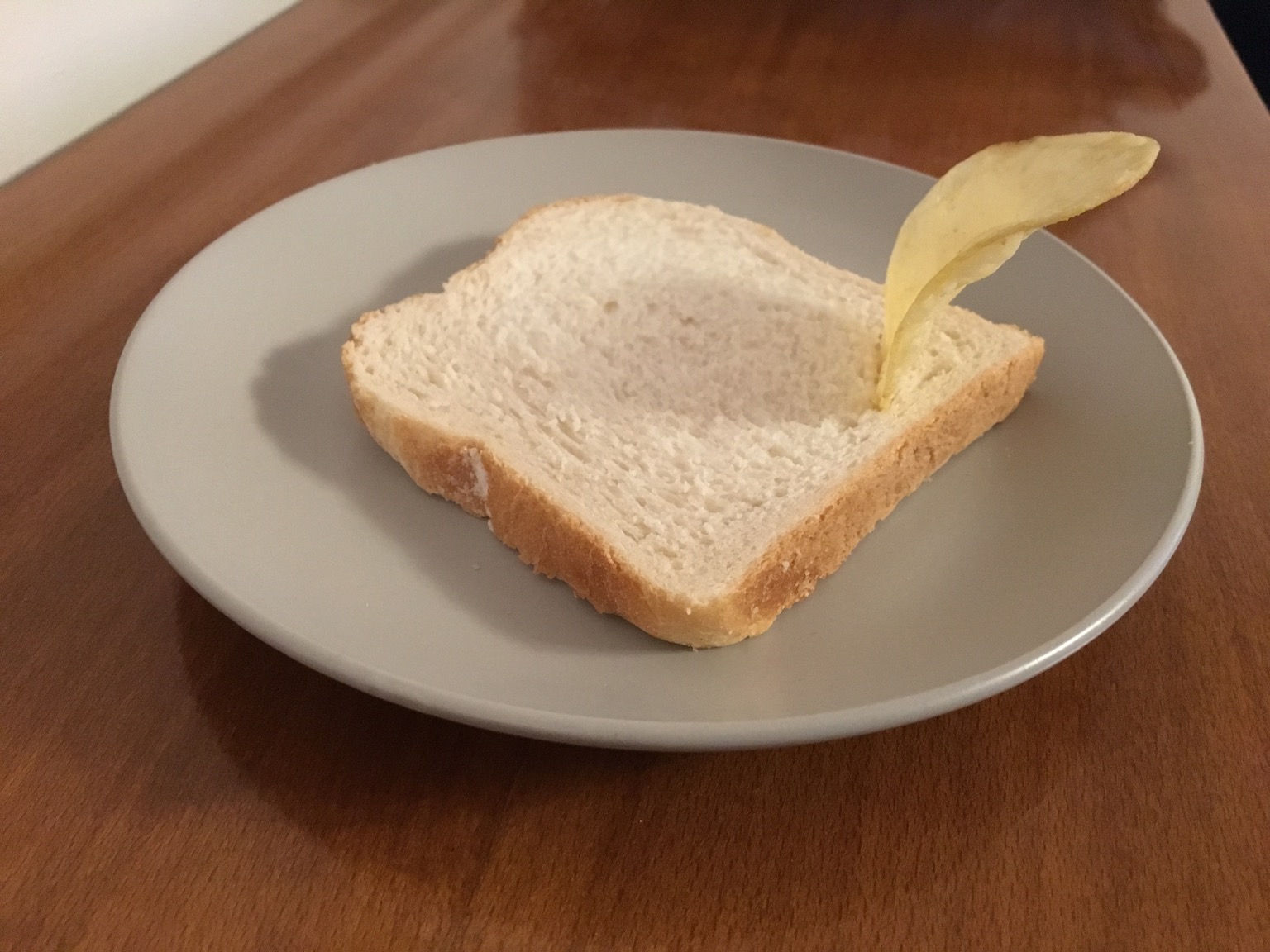 White sliced bread with a single crisp protruding