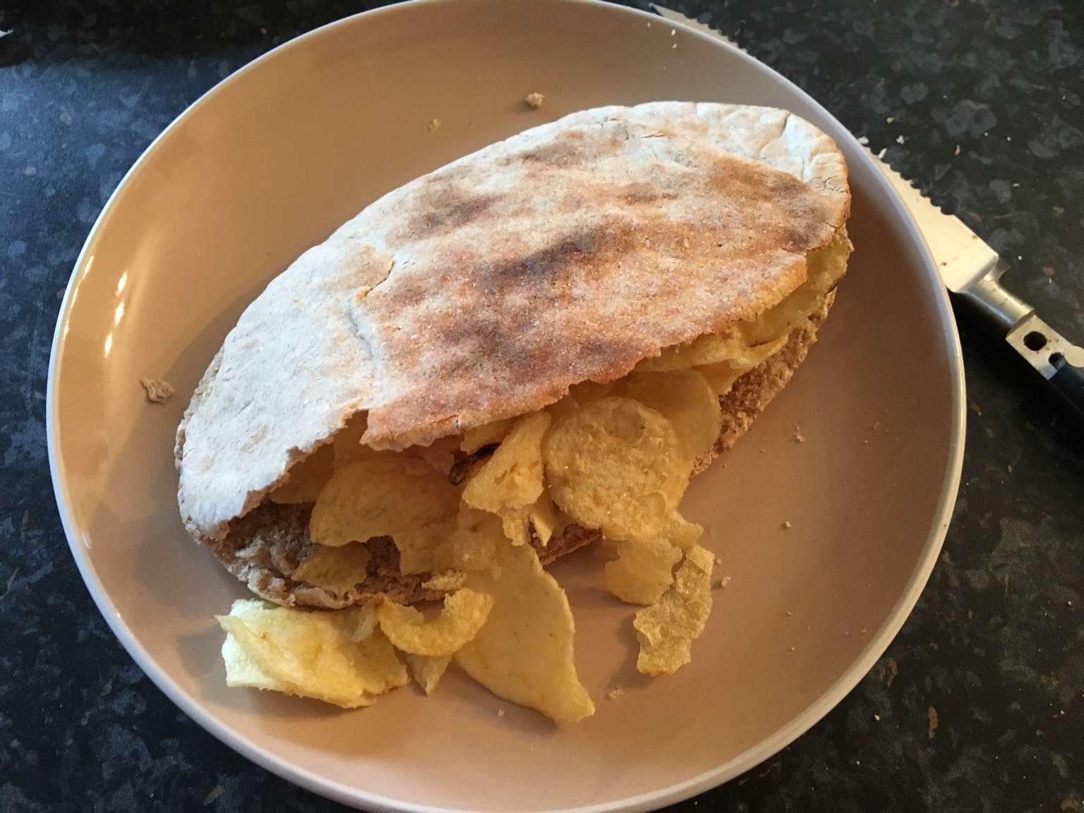 Wholemeal pita bread containing potato crisps