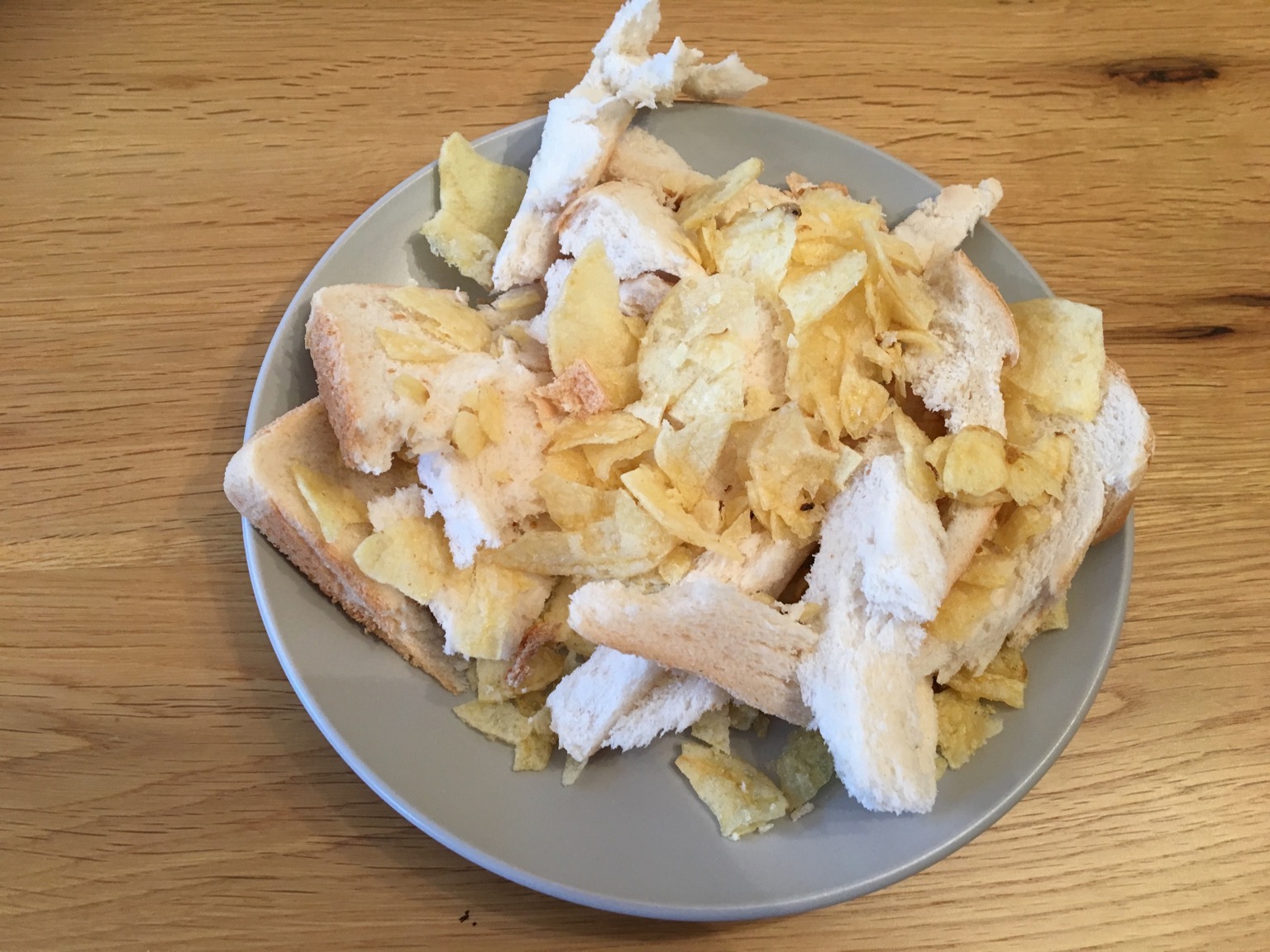 Chaotic pile of bread and crisps