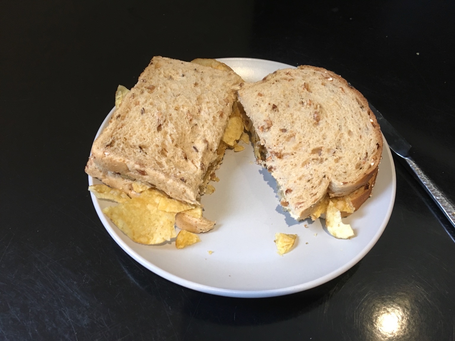 Brown crisp sandwich cut in half