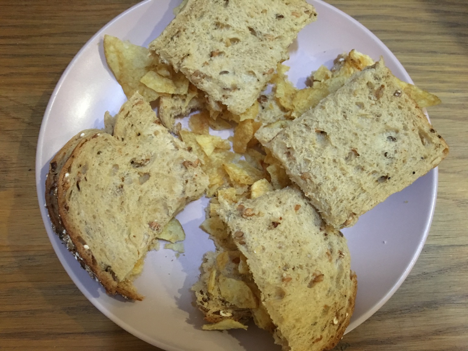 Brown crisp sandwich cut into quarters