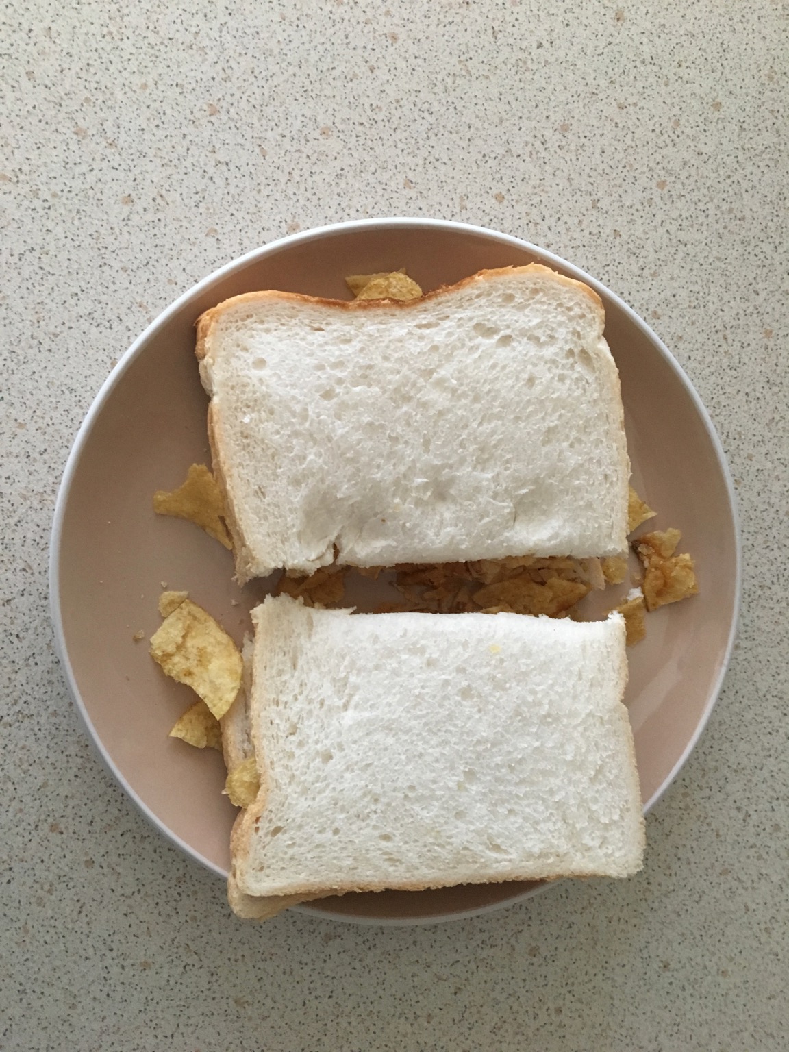Overhead view of halved white crisp sandwich