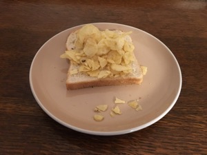 Potato crisps on a single slice of white bread