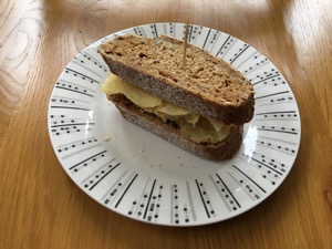 Small brown crisp sandwich with cocktail stick