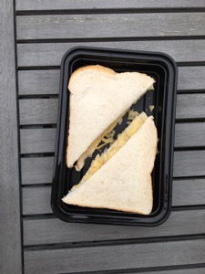 Overhead view of white crisp sandwich in a tray